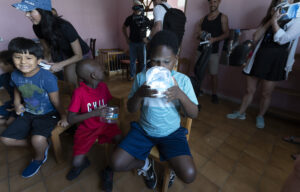 Young male student looking at a Solcius solar lantern